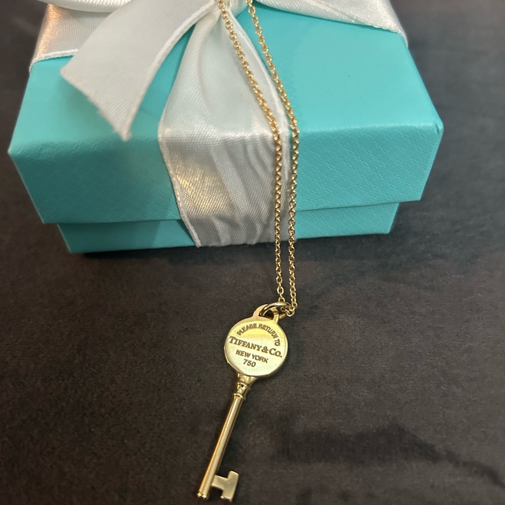 Tiffany & Co. gold key and chain.